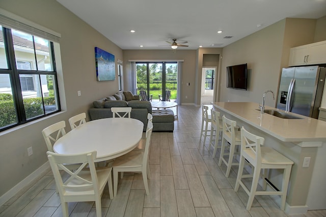 dining space with wood tiled floor, visible vents, baseboards, and recessed lighting