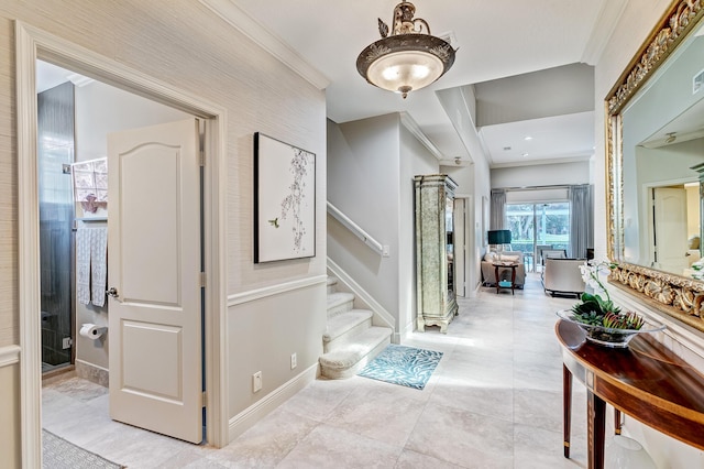 interior space with ornamental molding and light tile patterned floors