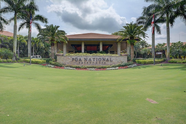 community sign featuring a lawn