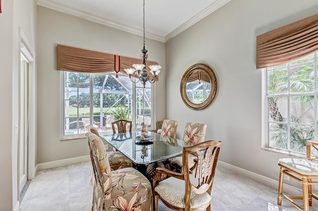 dining area featuring a notable chandelier, plenty of natural light, and ornamental molding