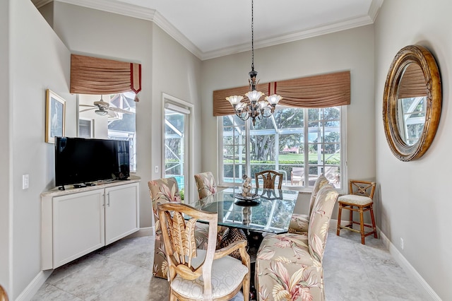 dining area featuring crown molding and ceiling fan with notable chandelier