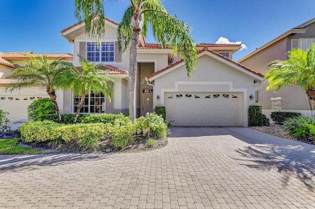 view of front of property with a garage