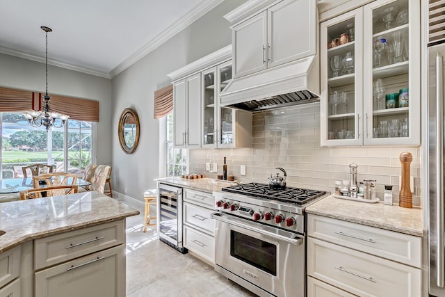 kitchen with crown molding, designer stove, custom range hood, decorative light fixtures, and beverage cooler