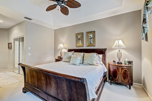 bedroom featuring light carpet and ceiling fan