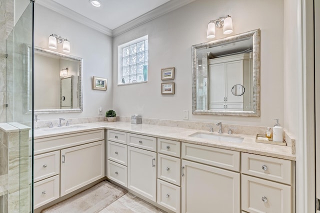 bathroom with vanity, a shower with shower door, and ornamental molding