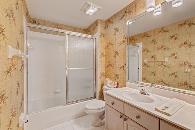 full bathroom with vanity, tile patterned flooring, enclosed tub / shower combo, and toilet