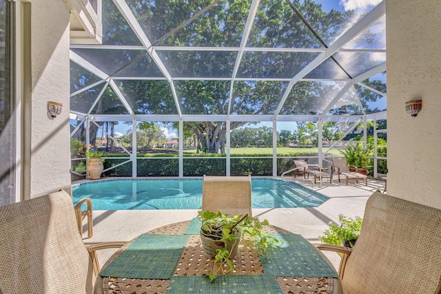 view of pool featuring a lanai and a patio