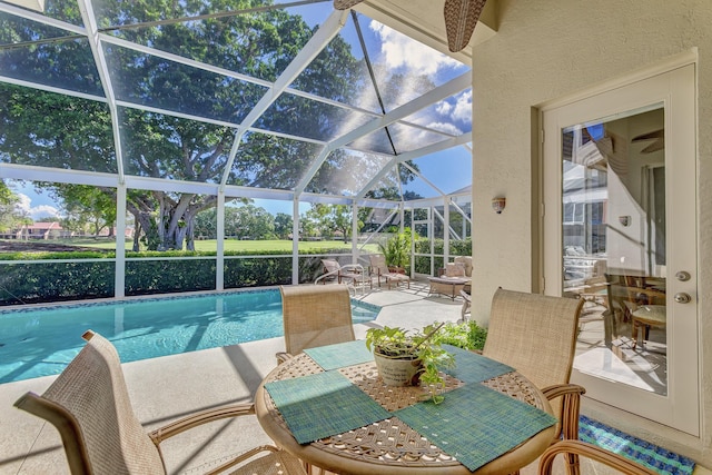 view of pool with a lanai and a patio