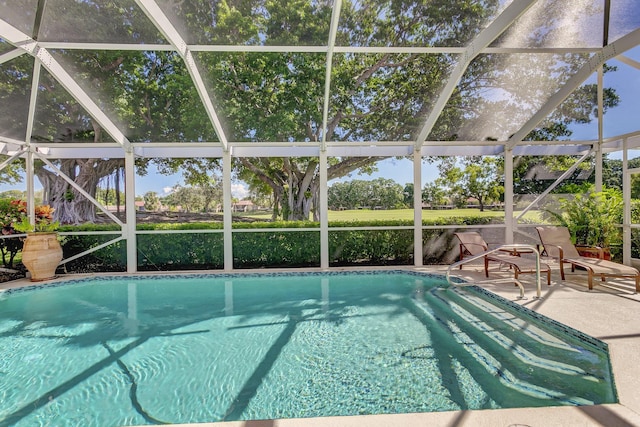 view of pool featuring a patio and glass enclosure