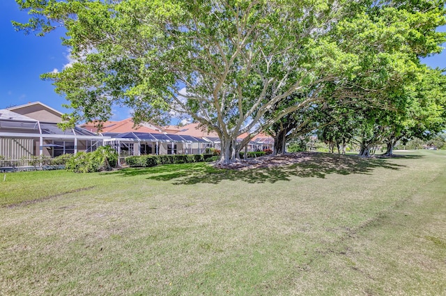 view of yard featuring glass enclosure