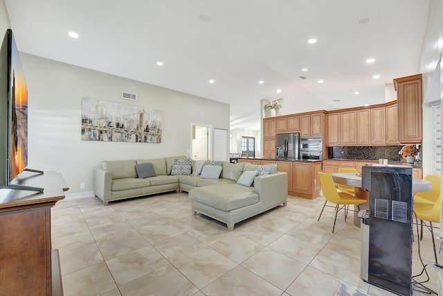 tiled living room with lofted ceiling