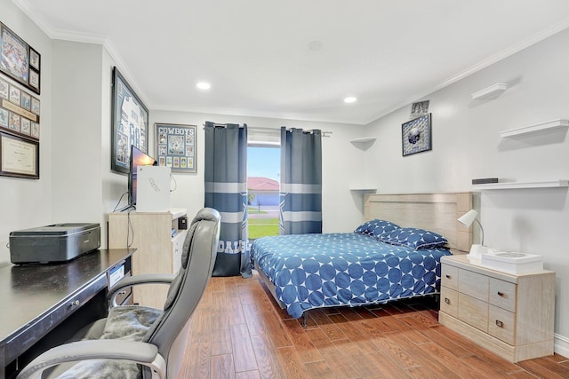 bedroom featuring ornamental molding and dark hardwood / wood-style floors