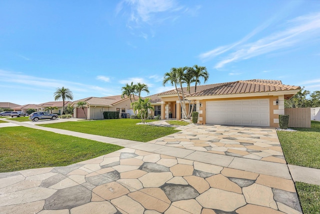 view of front of home with a garage and a front yard