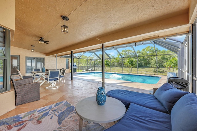 view of pool with an outdoor hangout area, a lanai, a patio area, and ceiling fan