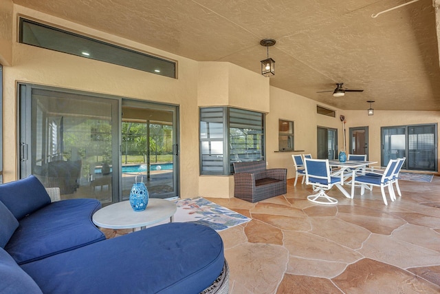 view of patio featuring ceiling fan