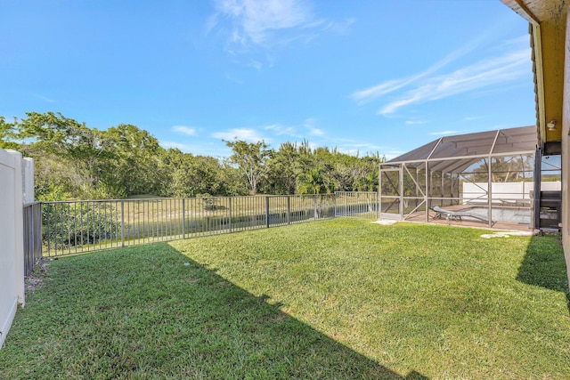 view of yard with a lanai