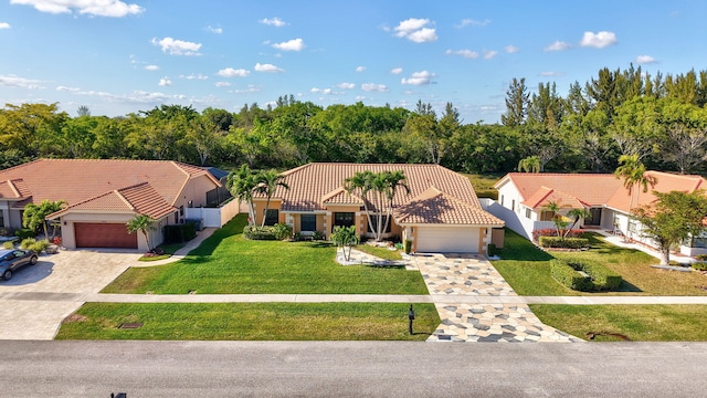 view of front facade with a garage and a front yard