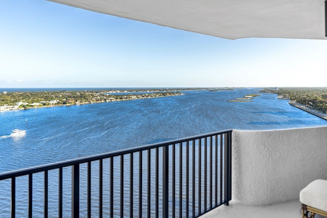 balcony featuring a water view