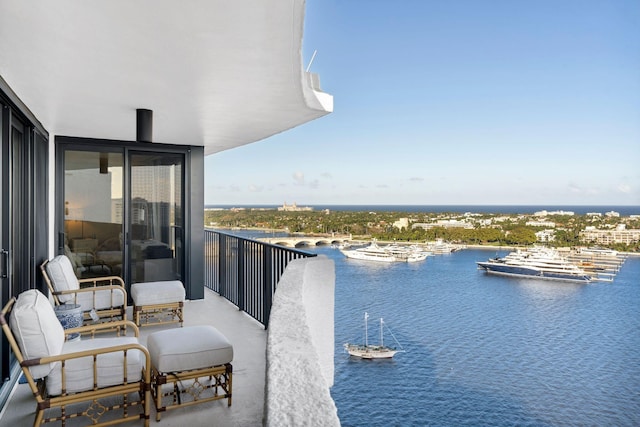 balcony featuring a water view