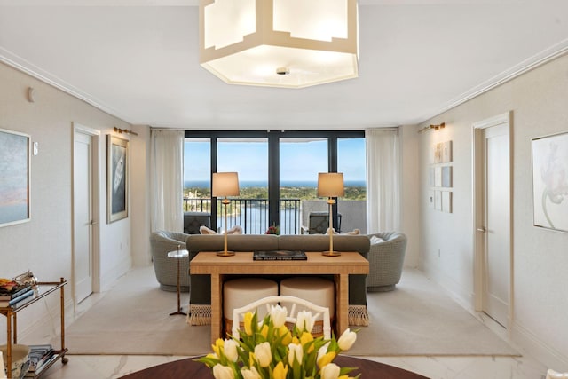 living room with floor to ceiling windows and a water view