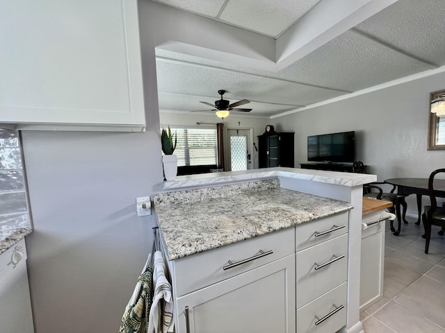 225 Westbury L 225, Deerfield Beach, FL 33442 - kitchen with a drop ceiling, white cabinets, light tile patterned floors, light stone countertops, and ceiling fan