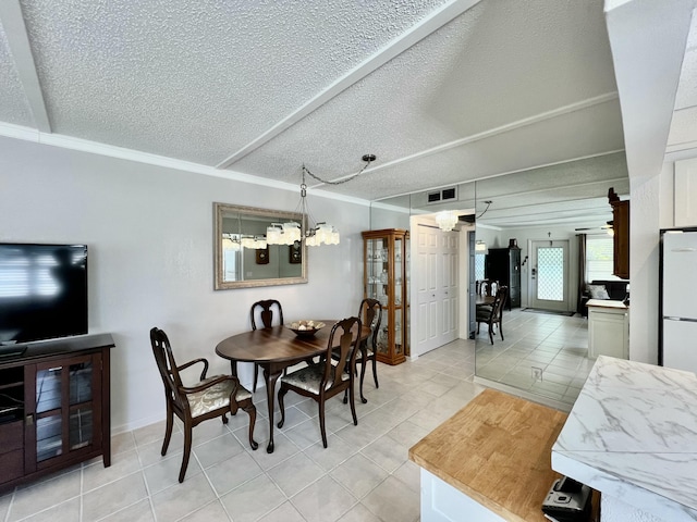 225 Westbury L 225, Deerfield Beach, FL 33442 - dining space featuring crown molding, light tile patterned flooring, visible vents, and a textured ceiling