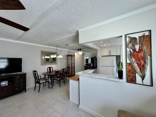 225 Westbury L 225, Deerfield Beach, FL 33442 - kitchen featuring white cabinetry, crown molding, light countertops, and freestanding refrigerator