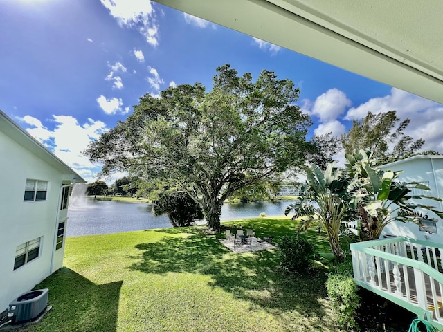 225 Westbury L 225, Deerfield Beach, FL 33442 - view of yard with central AC unit and a water view
