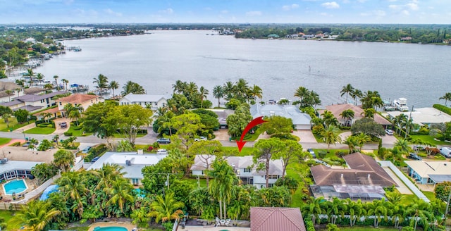 drone / aerial view with a residential view and a water view