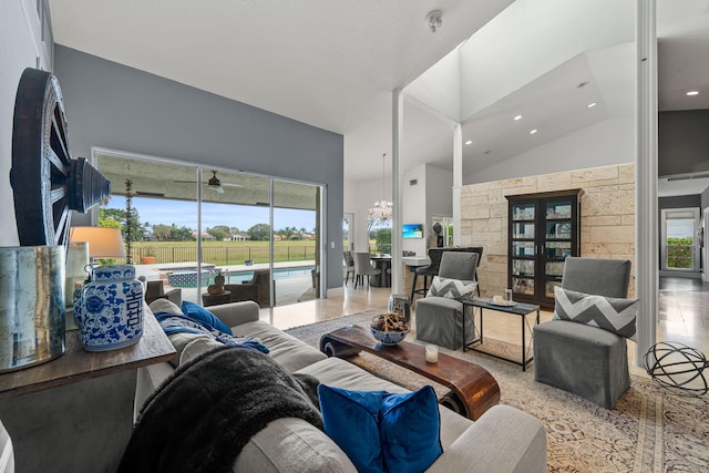 living room featuring high vaulted ceiling