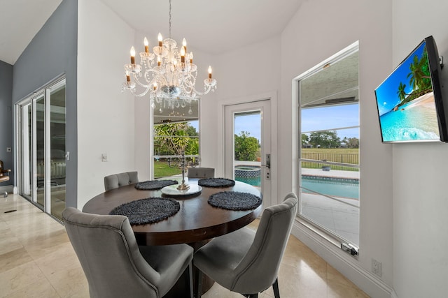 dining space featuring an inviting chandelier