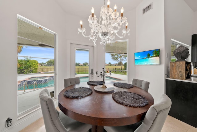 tiled dining area with a notable chandelier