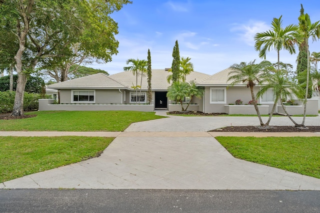 ranch-style house with a front yard