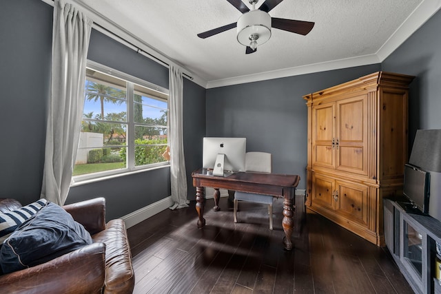 home office with dark wood-type flooring, ceiling fan, crown molding, and a textured ceiling