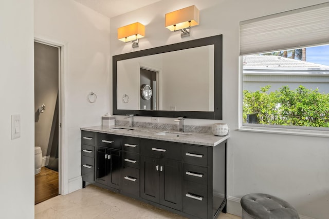 bathroom with vanity and a healthy amount of sunlight