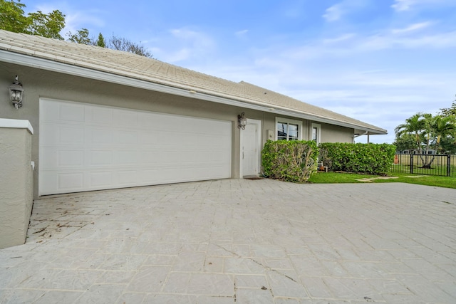 single story home with a garage