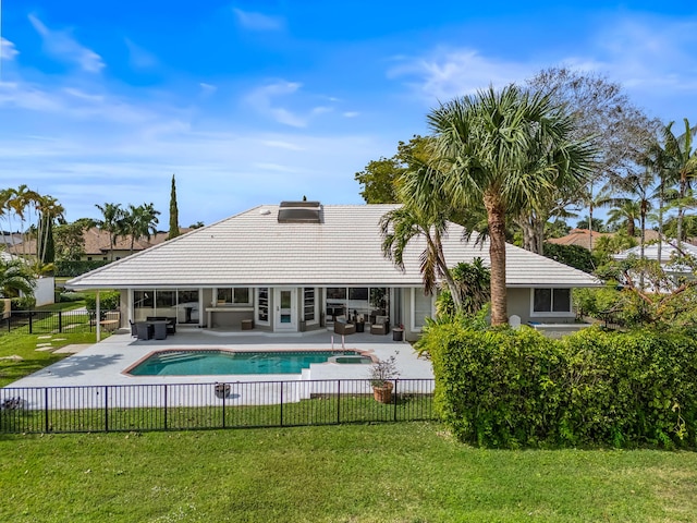 rear view of property with a yard, an outdoor hangout area, and a patio