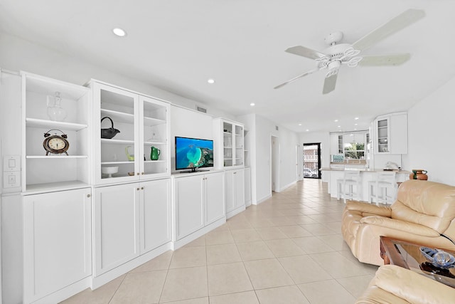 living area featuring recessed lighting, light tile patterned flooring, ceiling fan, and visible vents