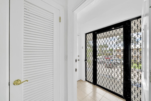 foyer featuring light tile patterned floors