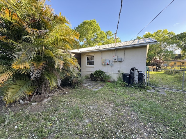 back of property with a yard