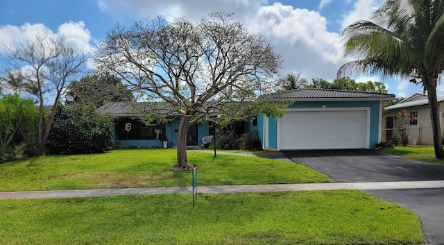 1821 N 50th Ave, Hollywood, FL 33021 - single story home featuring asphalt driveway, an attached garage, a front lawn, and stucco siding