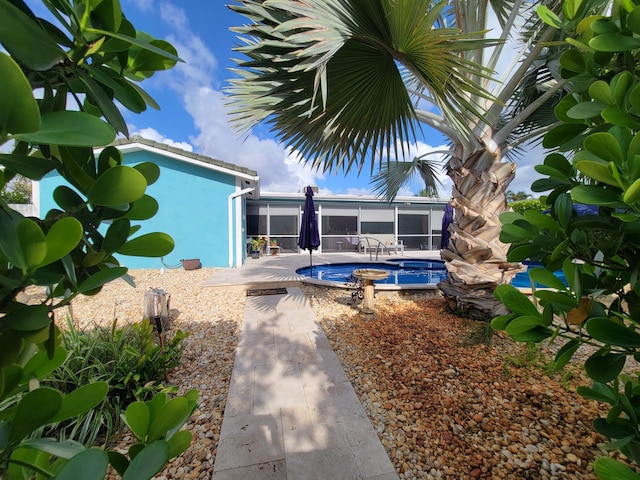 1821 N 50th Ave, Hollywood, FL 33021 - swimming pool with a sunroom and a patio area