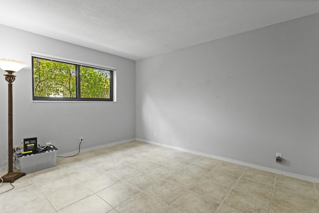 1821 N 50th Ave, Hollywood, FL 33021 - spare room featuring a textured ceiling and baseboards