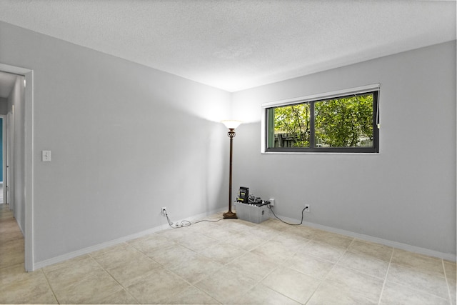 1821 N 50th Ave, Hollywood, FL 33021 - spare room with a textured ceiling and baseboards