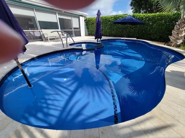 1821 N 50th Ave, Hollywood, FL 33021 - view of swimming pool with a sunroom, a pool with connected hot tub, and a patio area