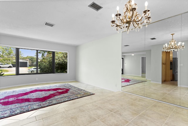 1821 N 50th Ave, Hollywood, FL 33021 - spare room featuring a chandelier and tile patterned flooring