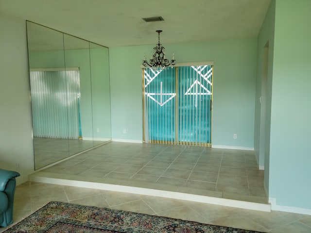 1821 N 50th Ave, Hollywood, FL 33021 - tiled empty room with a chandelier and baseboards