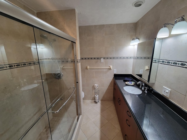 1821 N 50th Ave, Hollywood, FL 33021 - full bathroom featuring tile walls, vanity, tile patterned flooring, a shower stall, and toilet