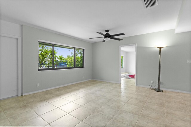 1821 N 50th Ave, Hollywood, FL 33021 - unfurnished room with healthy amount of natural light, a ceiling fan, light tile patterned flooring, and baseboards