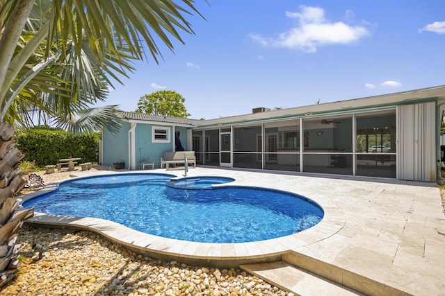 1821 N 50th Ave, Hollywood, FL 33021 - view of swimming pool with a sunroom, a ceiling fan, a patio, and a pool with connected hot tub